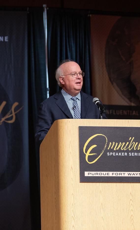 Karl Rove is speaking to the audience in Auer Performance Hall