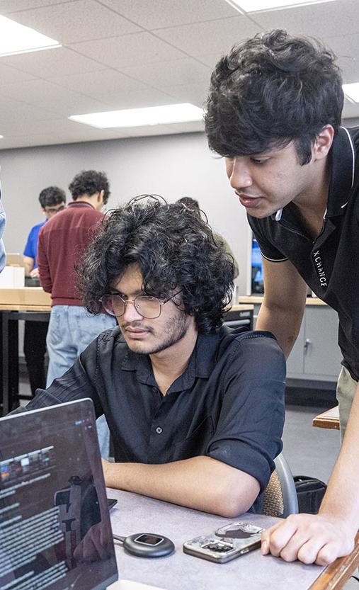 Members of the Lunabotics team are working on their project