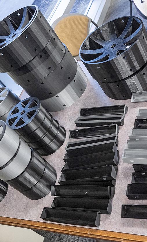 Parts of the lunar rover are displayed on a table