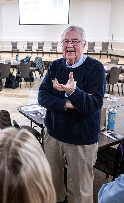 Attendees at a conference are speaking to each other