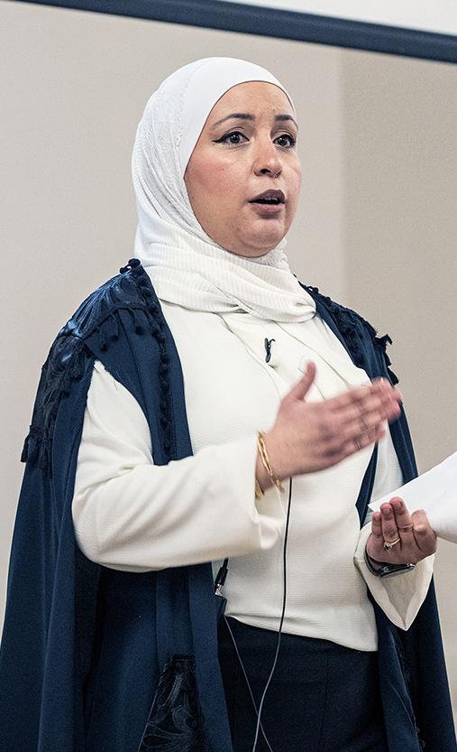 A professor speaking to an audience