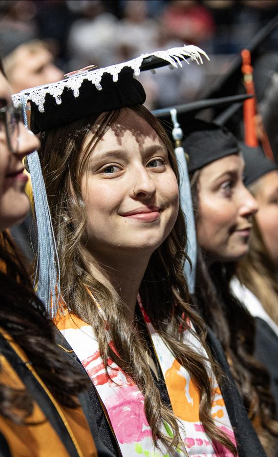 A student in a decorated cap attends the 2026 commencement ceremony