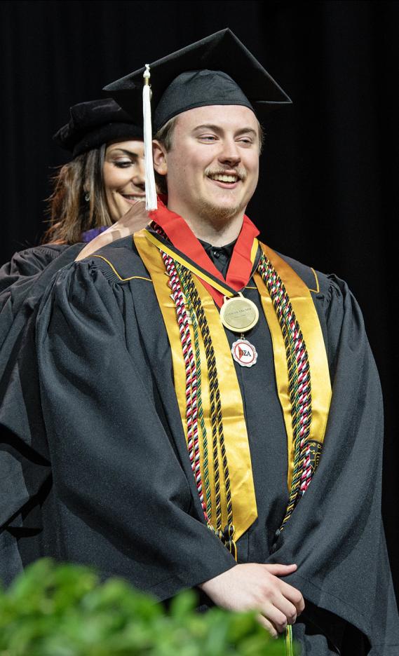 A student recieves a special honor at the 2026 commencement ceremony