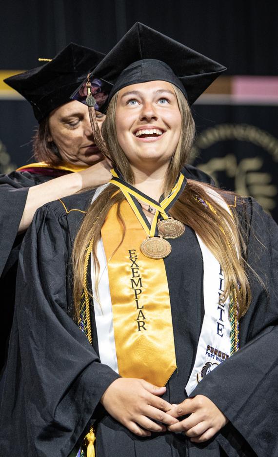 A female student recieves an honor at the 2026 commencement ceremony