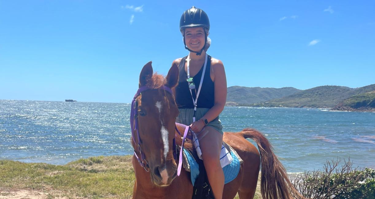 Maddie Book is riding a horse