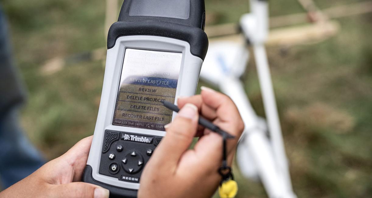PFW student using an instrument at an anthropology dig