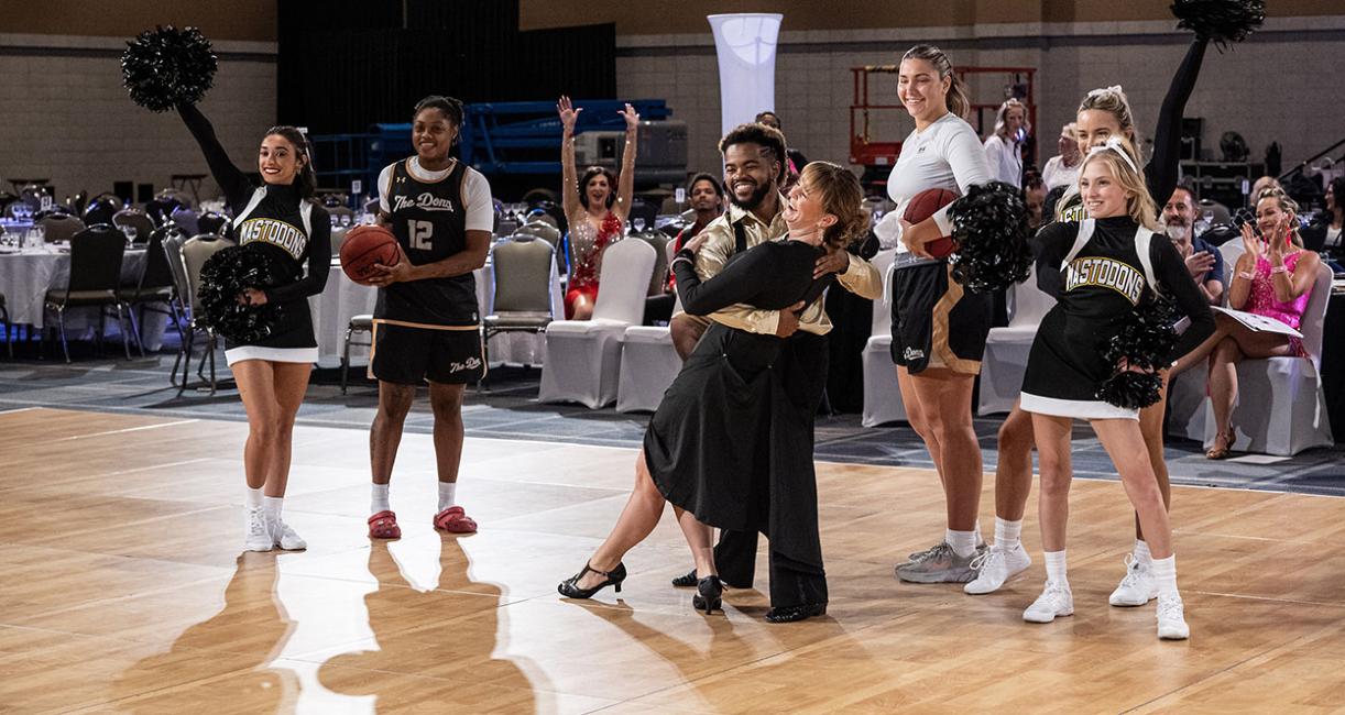 Kim Grannan, PFW cheerleaders, and women's basketball players