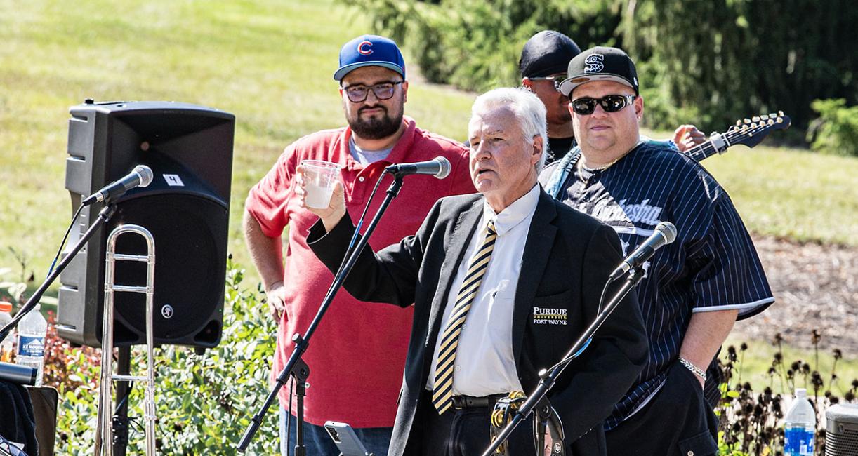 Chancellor Ron Elsenbaumer raises a toast at the Mastodon Family Picnic.