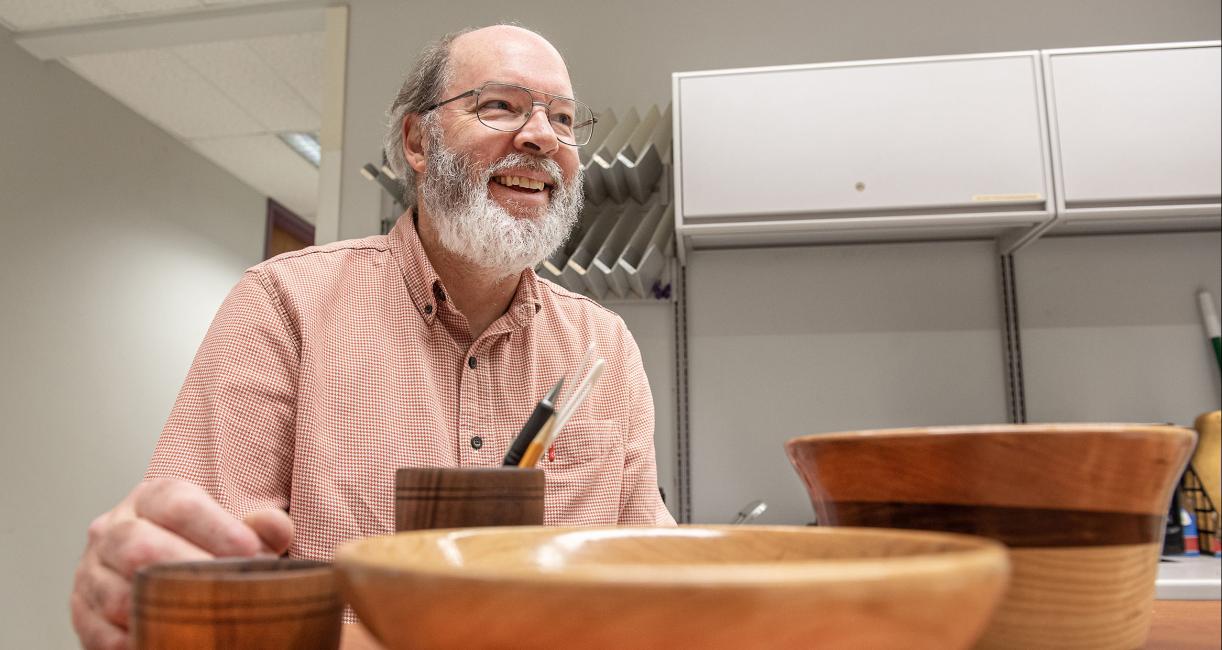 Barry Dupen displays some of the bowls he created.