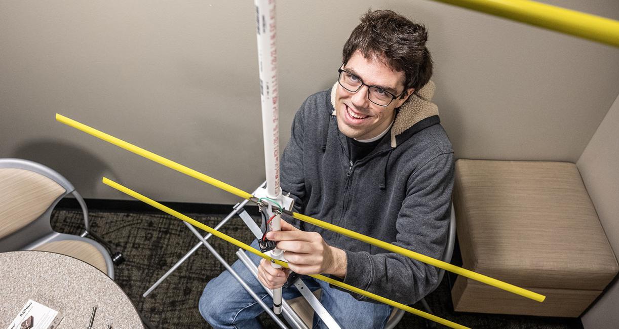 Andrew Danielson and his wildlife telemetry antenna.