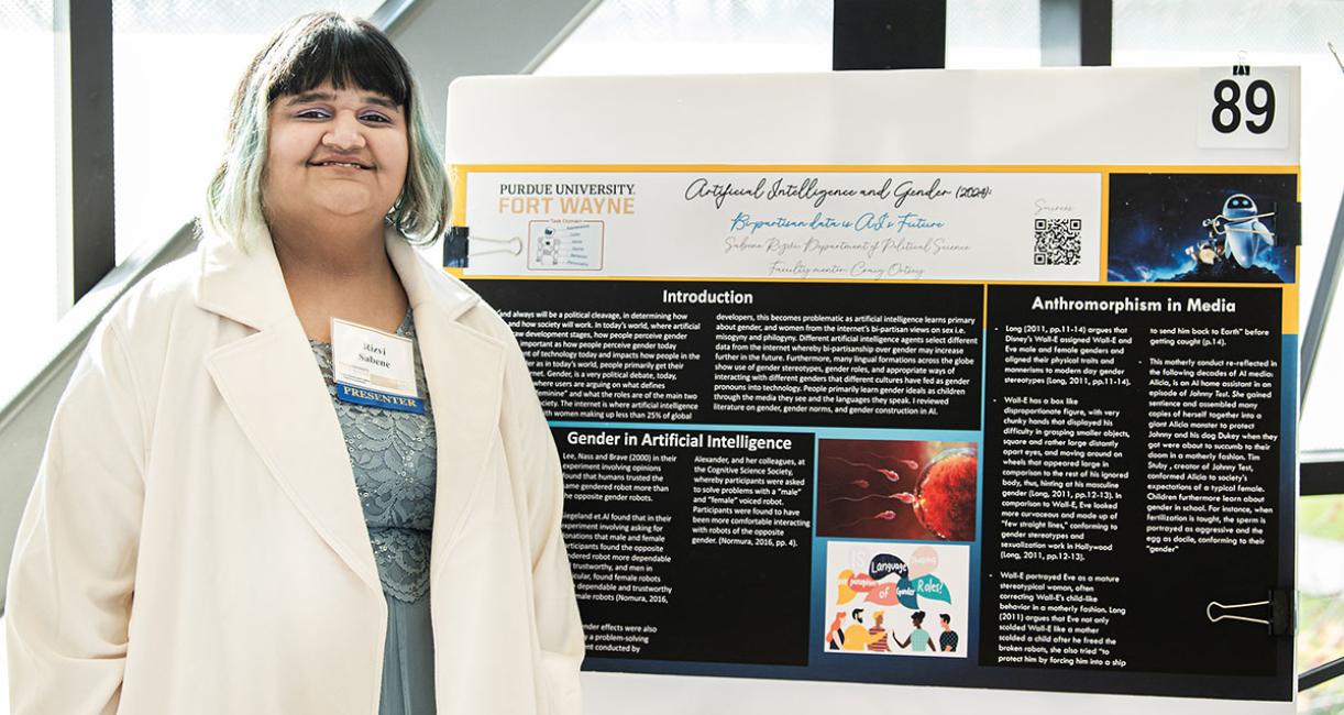 A student with her research poster