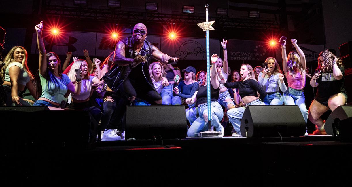 A group of students get low with Flo Rida.