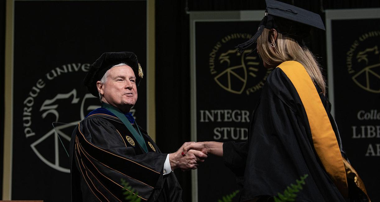 Chancellor Elsenbaumer congratulates a graduate