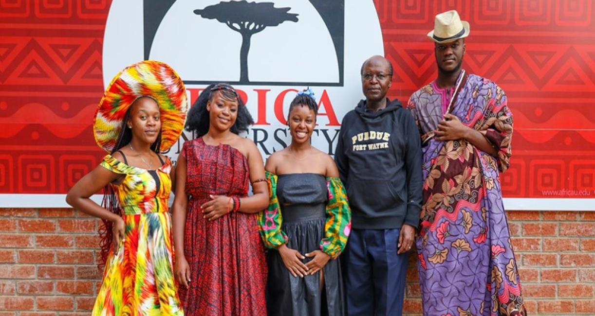 Professor Jospeter Mbuba with students on Cultural Night.