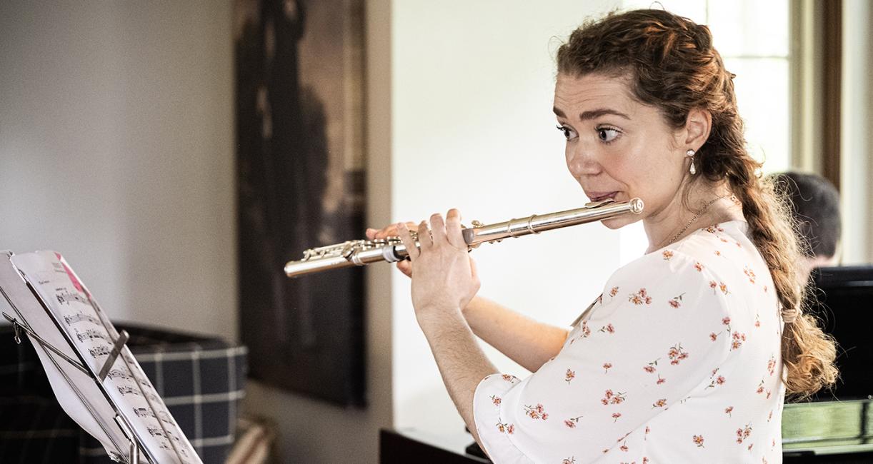 Katherine Marx is playing the flute