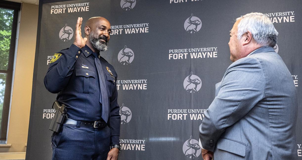 Chief Anthony Harrison was sworn in by Glen Nakata, PFW’s vice chancellor for financial and administrative affairs.