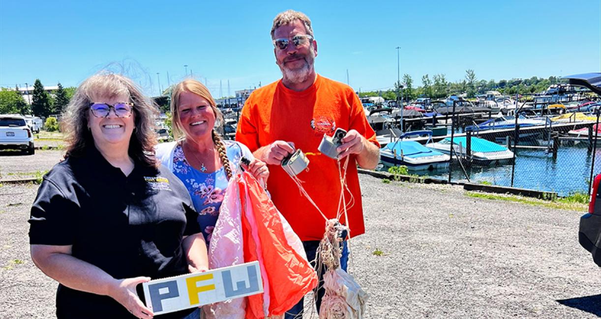 Janet North, coordinator of the ETCS Outreach Program, with Laura Maseto and Jason Wieczorek, who retrieved the weather balloon