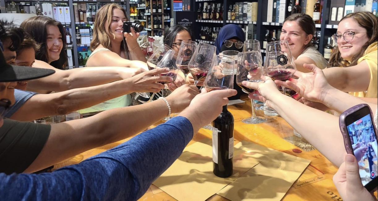 Students are at a wine tasting in Italy