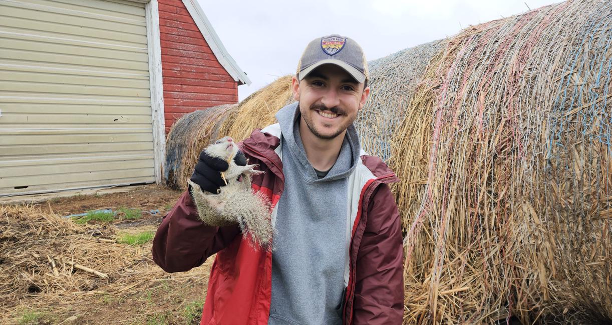 Justin Moore, graduate research assistant, with a Franklin's ground squirrel.