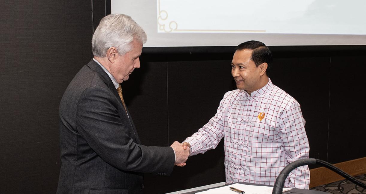 Chancellors Ron Elsenbaumer and Pon Nya Mon during the signing ceremony.