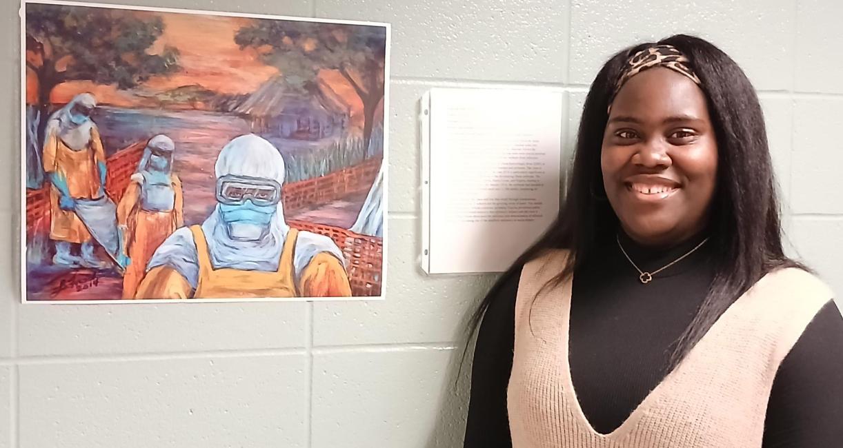 Chichi Jasper-Duruzor and the painting “Ebola.”