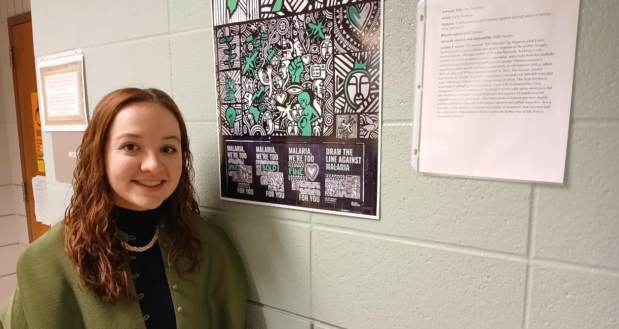 Nigerian artist Laolu’s green and black painting “The Muundo” highlighted senior Sadie Gerber’s description of malaria.