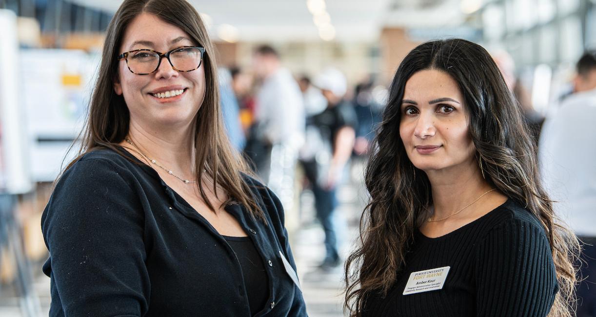 Two woman smiling