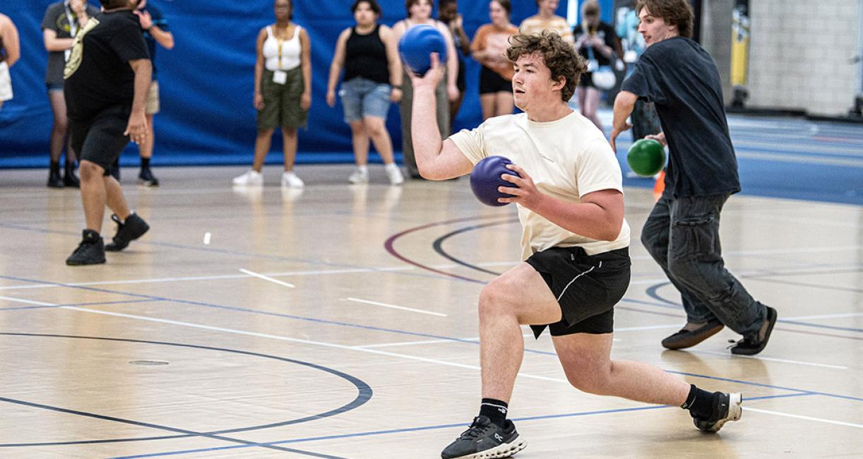 Students are playing dodgeball at NSO orientation