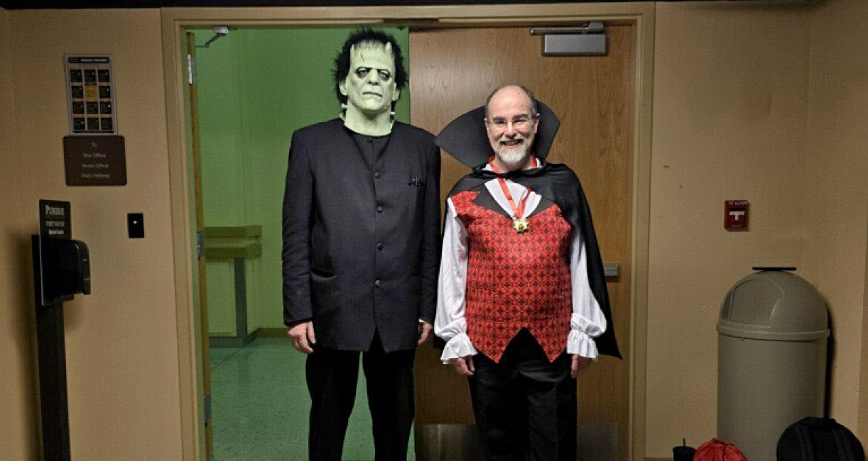 Conductor Kevin McMahon and pianist Hamilton Tescarollo are dressed as Frankenstein's monster and Dracula
