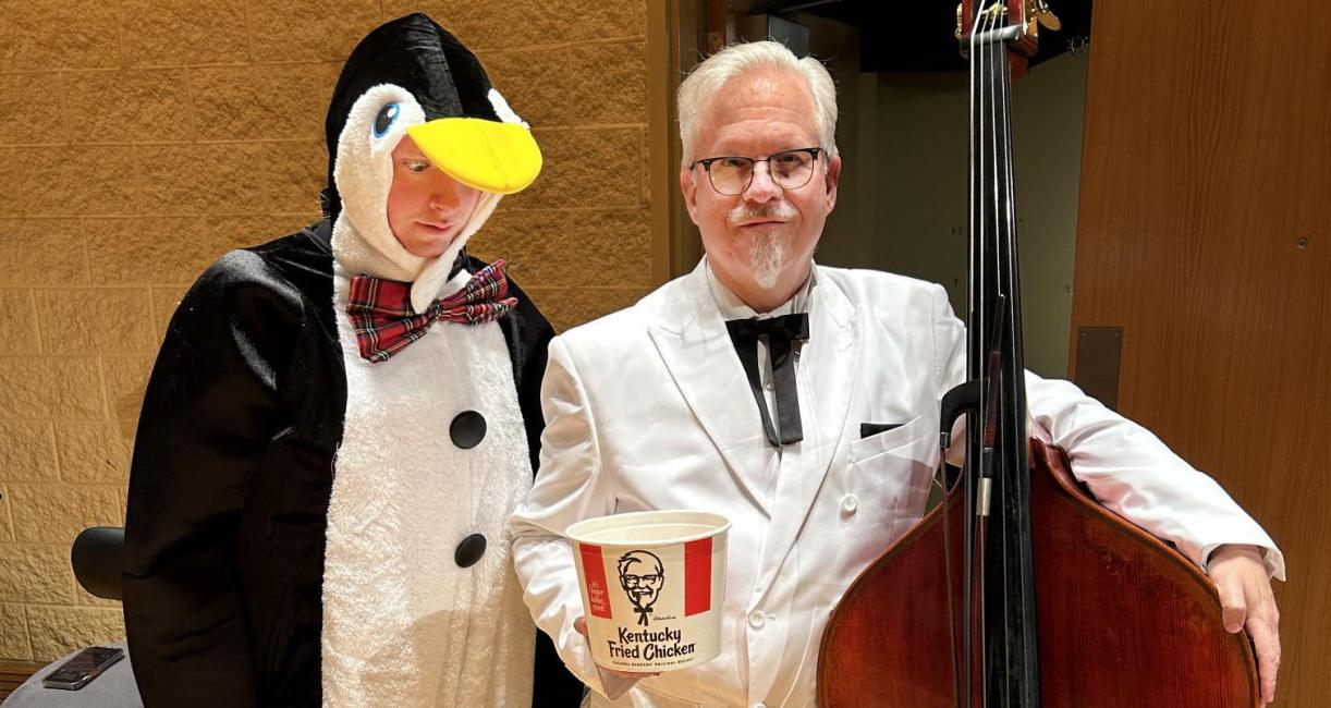 Evan Sroufe and his dad Rod are dressed as a penguin and Colonel Sanders