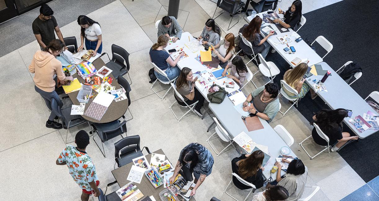 Overhead view of crafters sitting at tables