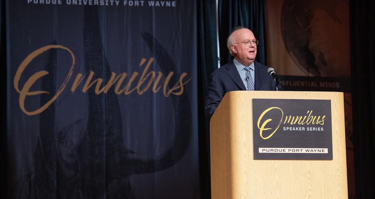 Karl Rove is speaking to the audience in Auer Performance Hall