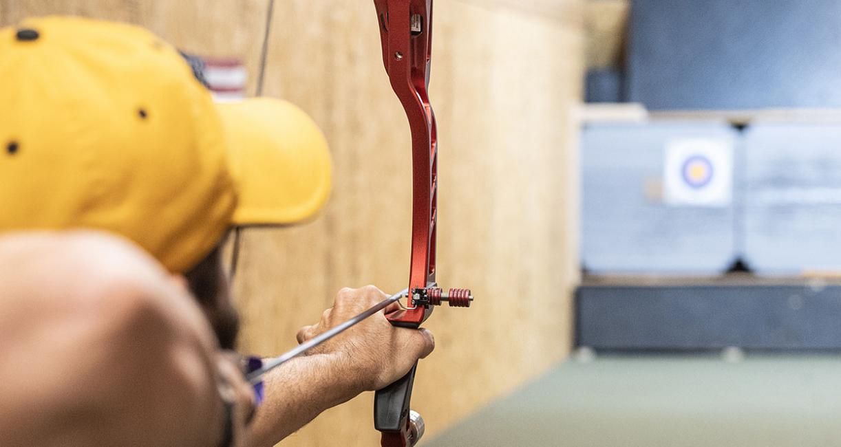 Cadd Amsler is in an archery range