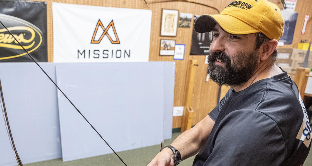 Cadd Amsler is in an archery range