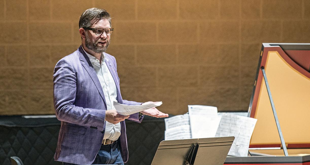 John Romey is talking onstage