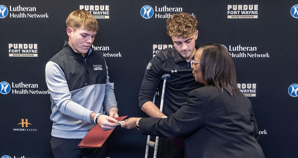 PFW golfers Landon Smith and A.J. Agnew, and Fort Wayne Mayor Sharon Tucker