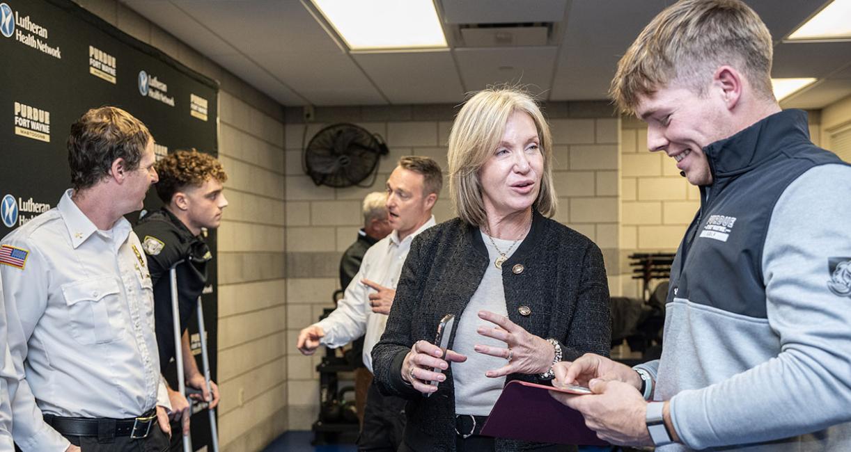 PFW golfer Landon Smith and Director of Athletics Kelley Hartley Hutton