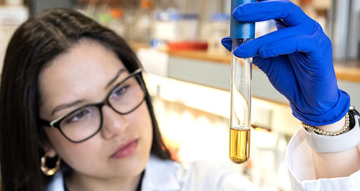 Perla Figueroa is holding a test tube