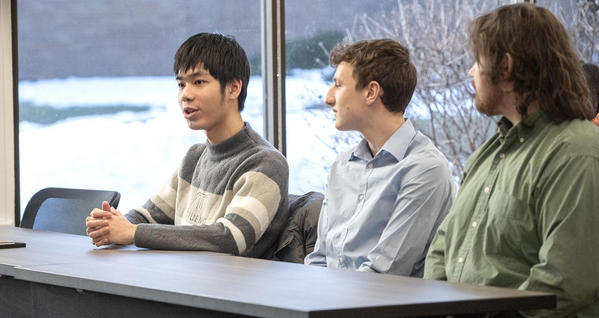 Students are sitting at a table