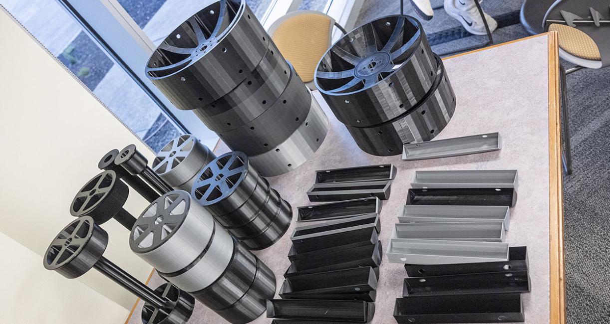 Parts of the lunar rover are displayed on a table