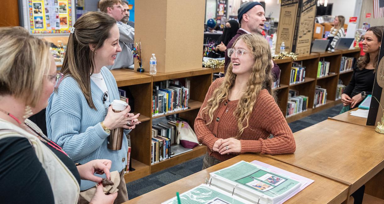 Students are conversing at the SOE Showcase