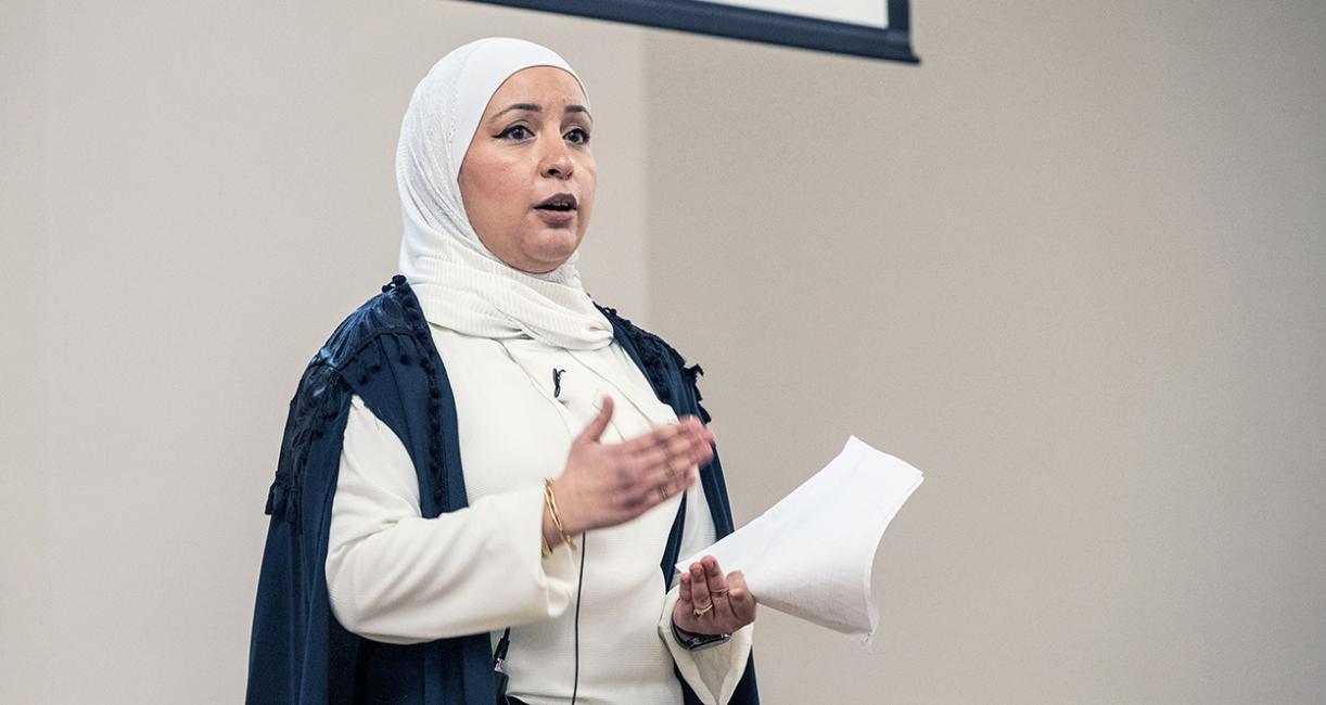 A professor speaking to an audience