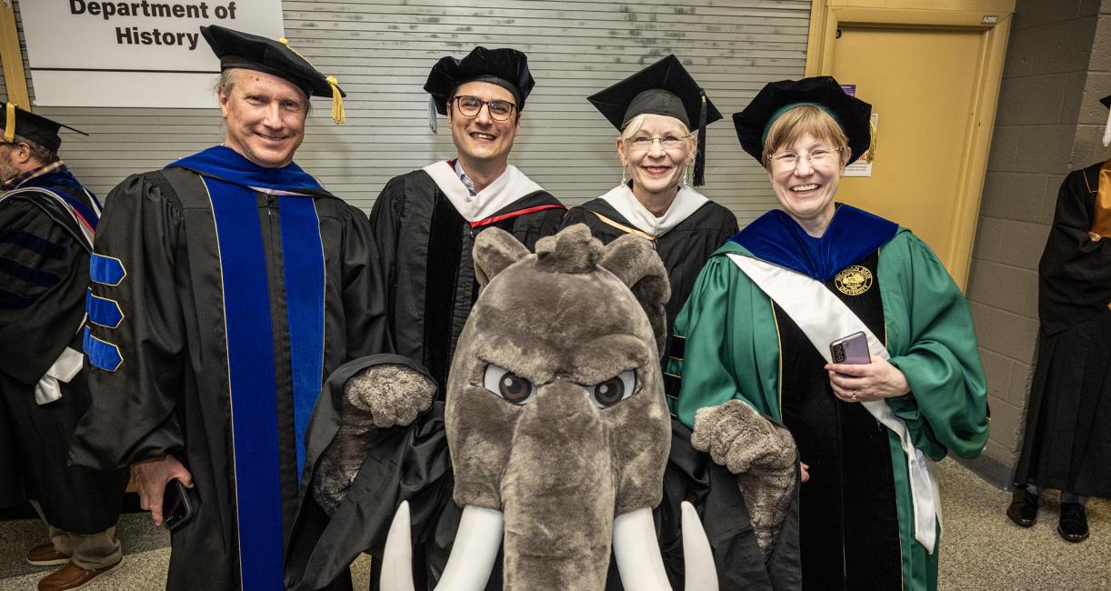 Don posses with factulty at the 2026 PFW commencement ceremony