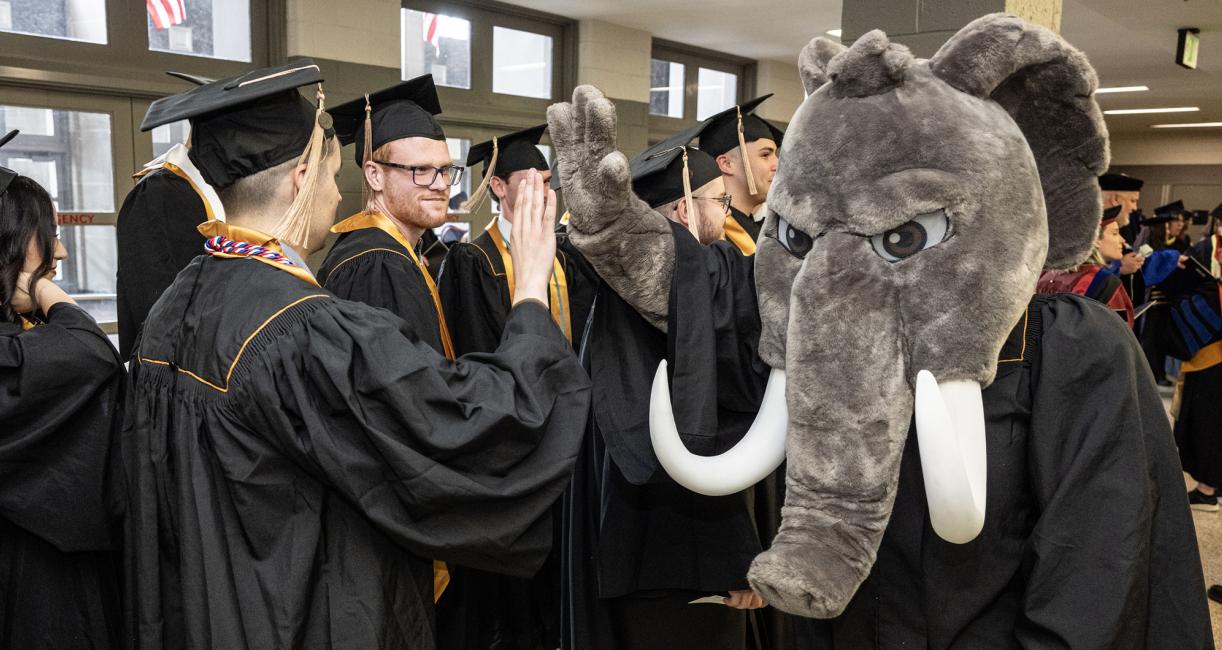 Don gives out high fives at the 2026 PFW commencement ceremony