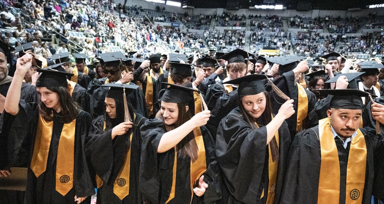 Students move their tassles during the 2026 PFW commencement ceremony