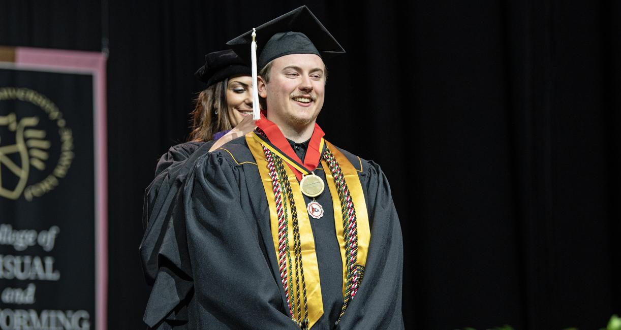 A student recieves a special honor at the 2026 commencement ceremony