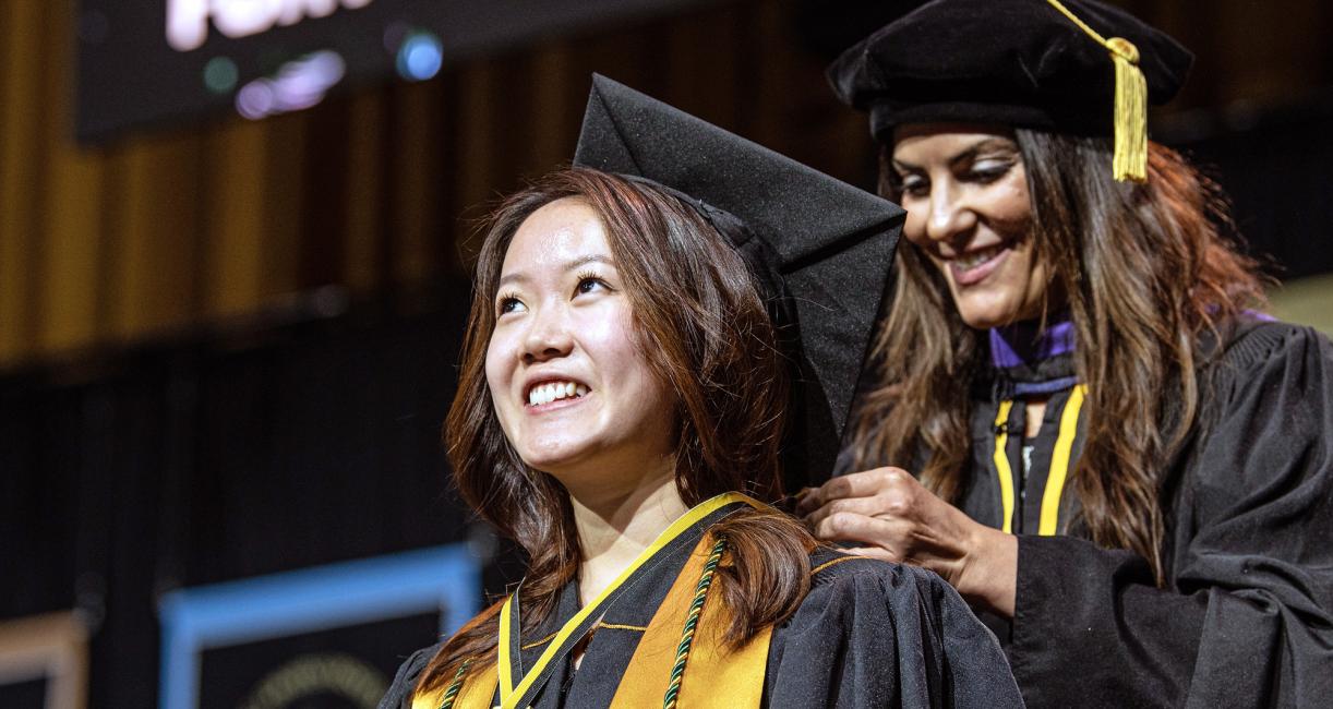 A female student recieves recognition during the 2026 commencement ceremony