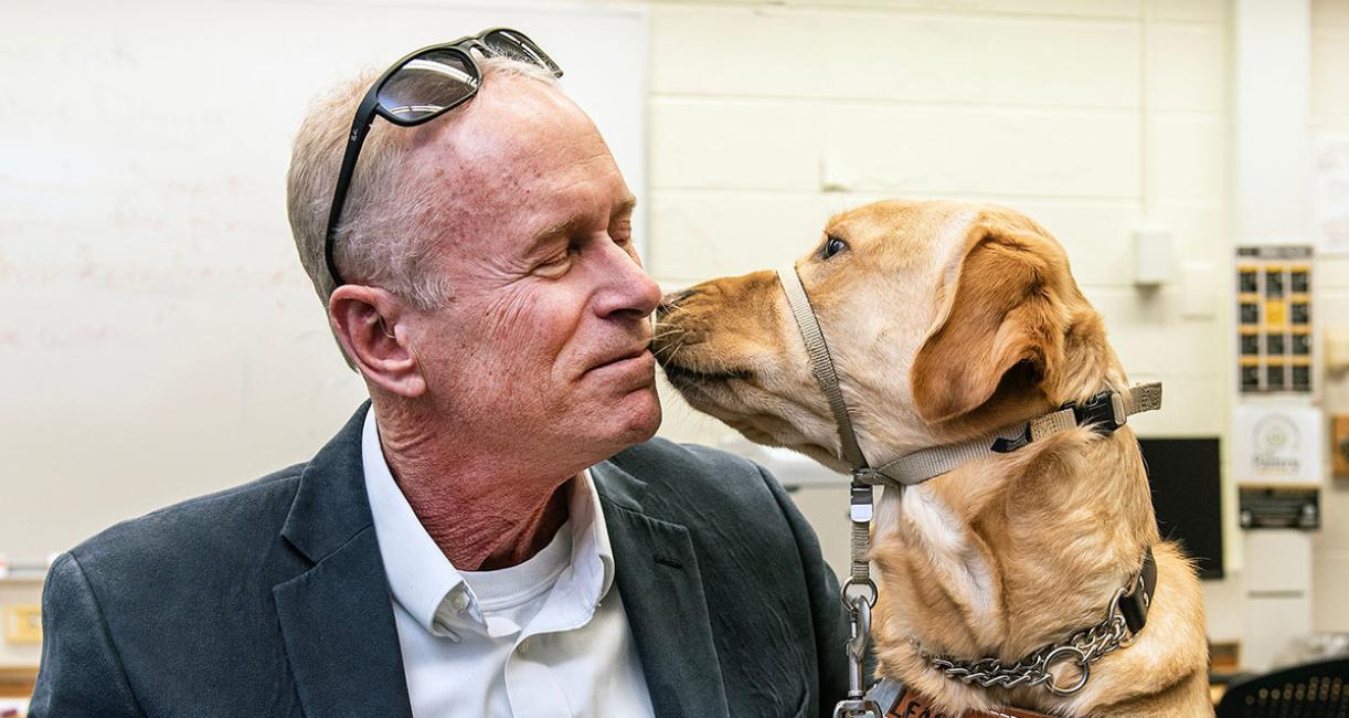 Jim Platzer is with a therapy dog