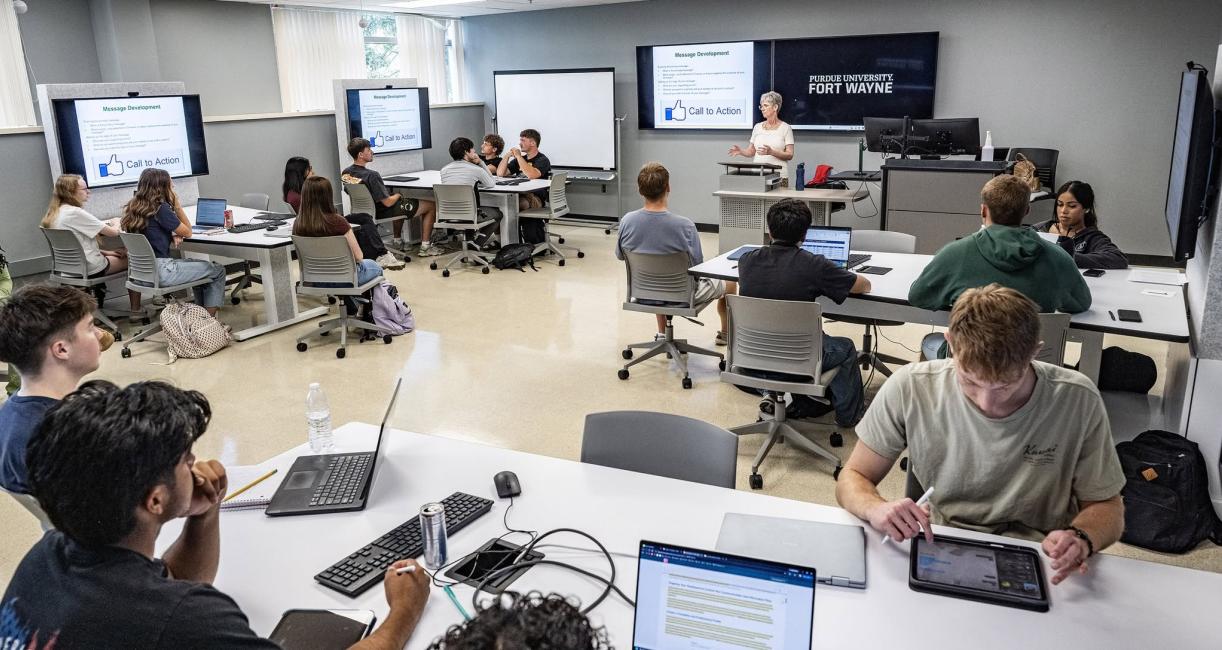 Student in a classroom in the Doermer School of Business building