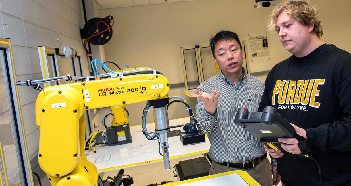 Professor and student in an engineering lab